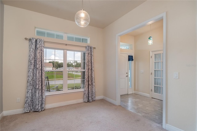 entryway featuring light carpet