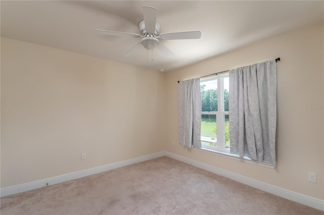 carpeted empty room with ceiling fan