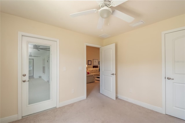 unfurnished bedroom featuring ceiling fan and light colored carpet