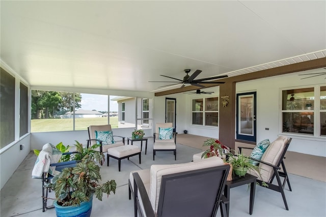 sunroom with ceiling fan