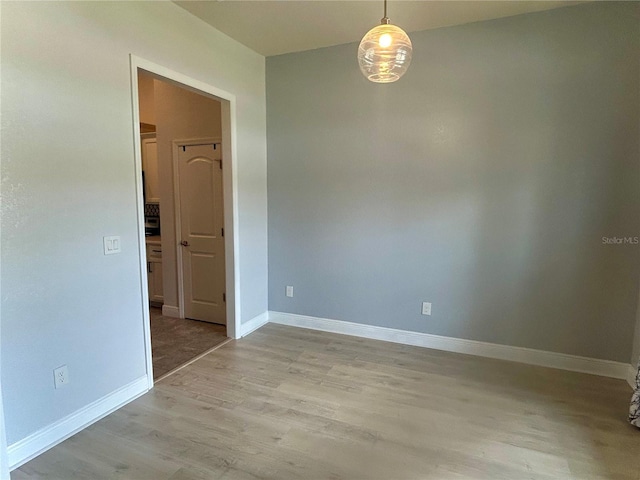 25 NW 45th Loop, Ocala, FL 34475 - spare room with light wood-style floors and baseboards