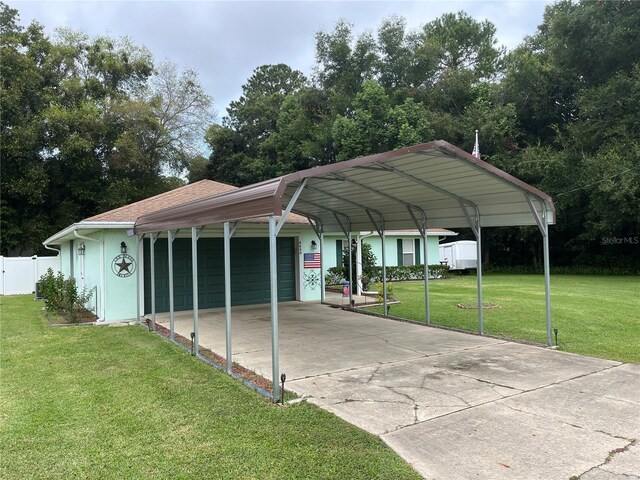 view of vehicle parking featuring a garage, a carport, and a lawn