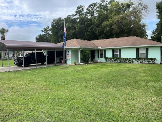 single story home featuring a carport and a front lawn