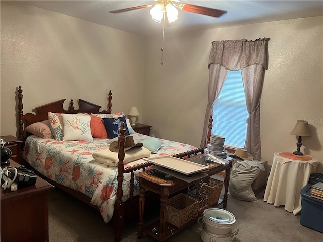 bedroom with ceiling fan and carpet