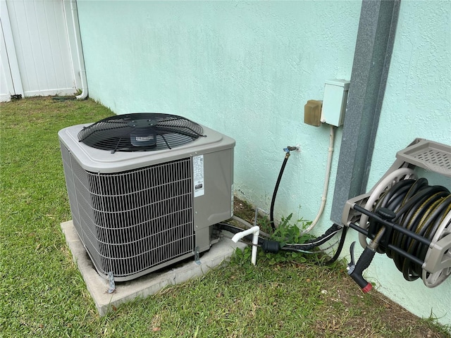 6690 Cherry Rd, Ocala, FL 34472 - exterior details featuring stucco siding and cooling unit