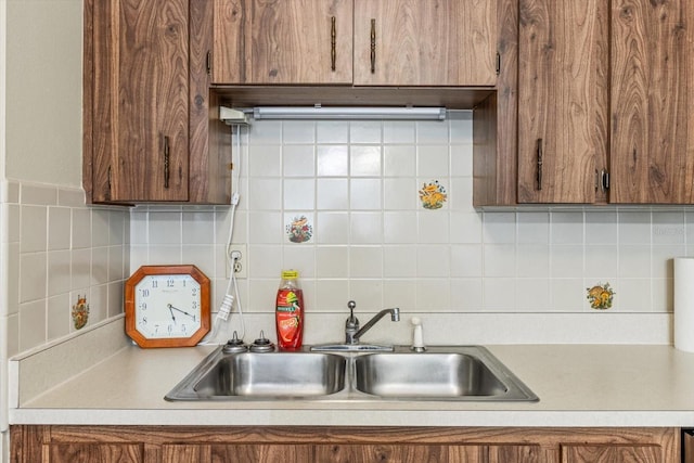 kitchen featuring sink and backsplash