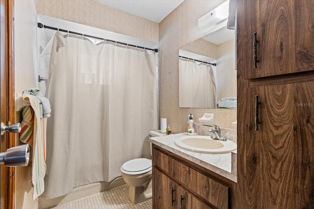 bathroom with tile patterned floors, toilet, and vanity