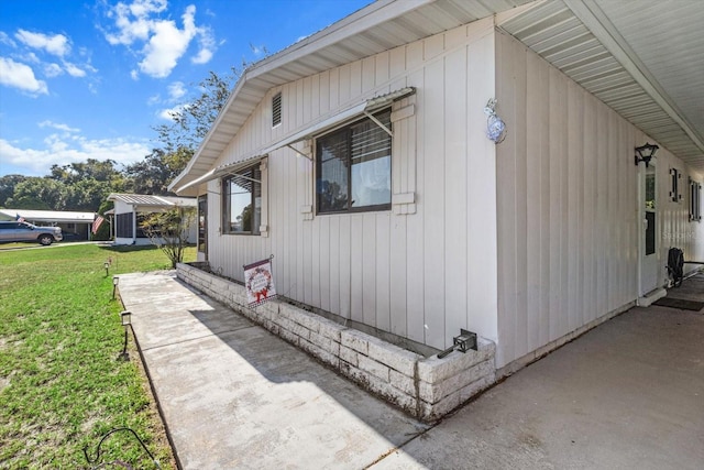 view of property exterior with a lawn