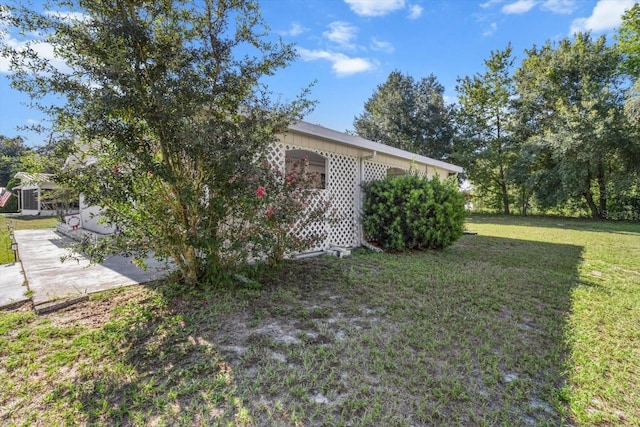 view of property exterior featuring a yard