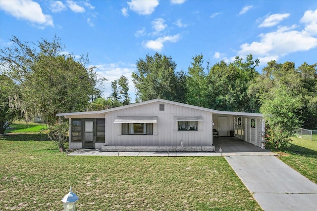 single story home featuring a carport and a front yard