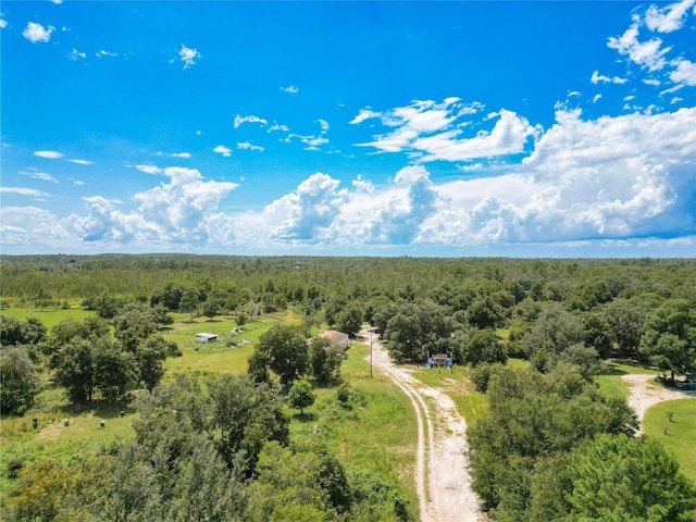 drone / aerial view with a view of trees