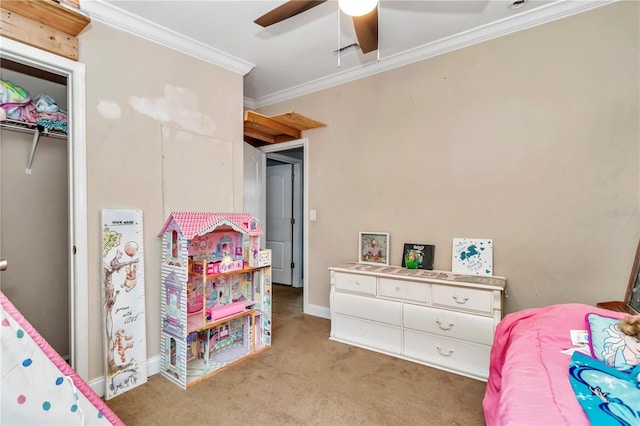 carpeted bedroom featuring a closet, ceiling fan, and ornamental molding