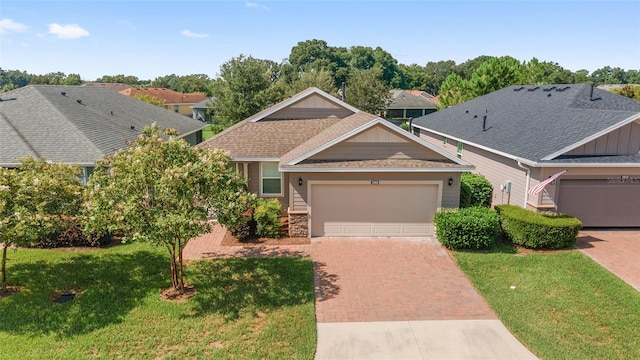 view of front facade featuring a garage and a front lawn