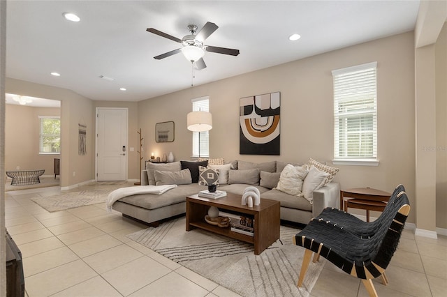 living room with ceiling fan and light tile patterned floors