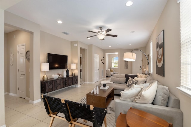 tiled living room featuring ceiling fan