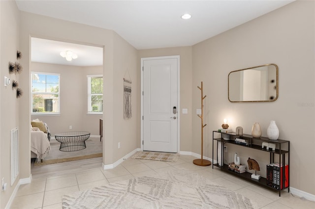 entryway featuring light tile patterned floors