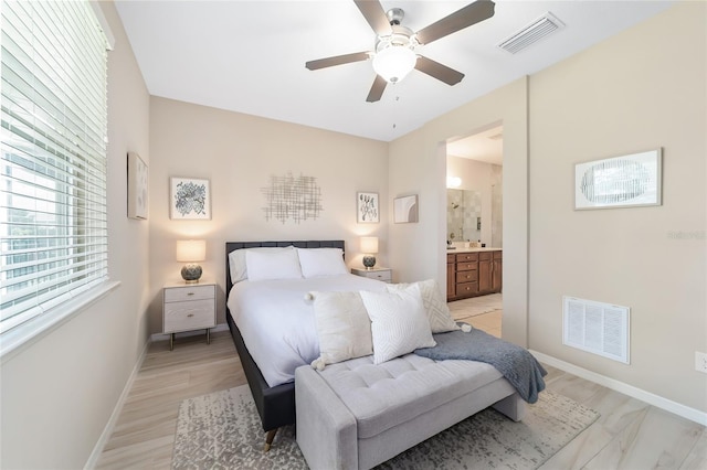 bedroom with ensuite bathroom and ceiling fan