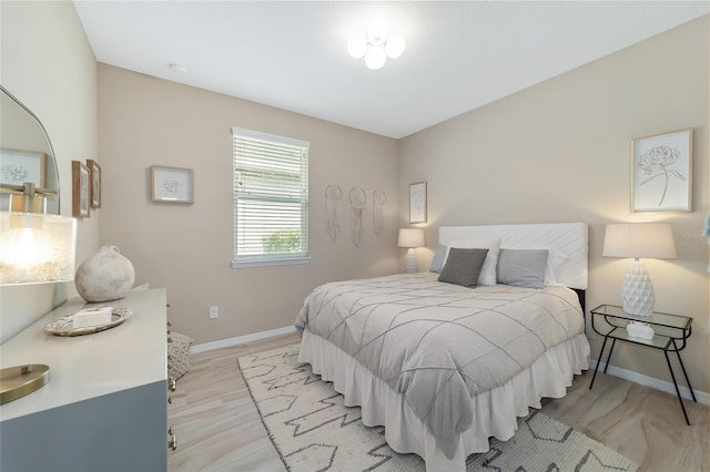 bedroom with light hardwood / wood-style floors