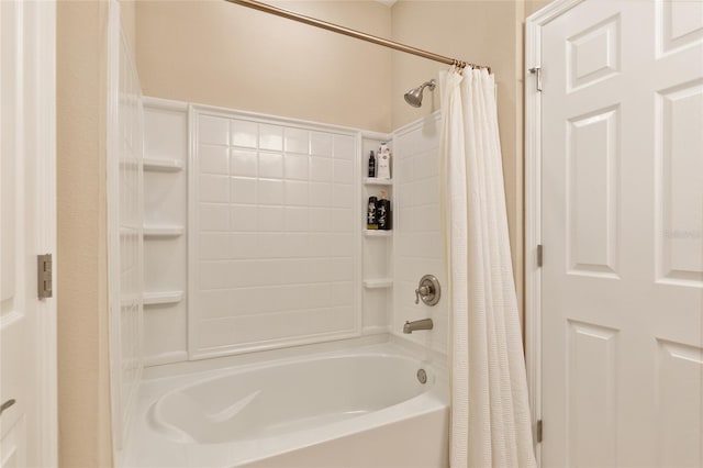 bathroom featuring shower / bath combo with shower curtain