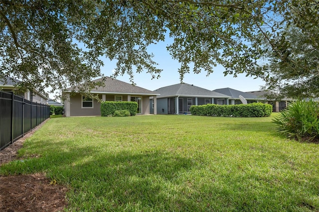 back of house with a yard