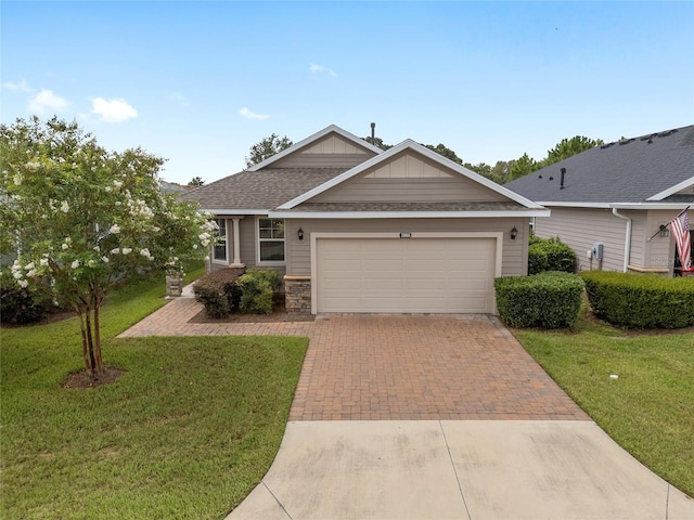 view of front of house with a garage and a front yard