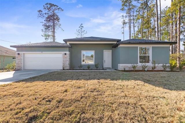 view of front of property with a garage, concrete driveway, stucco siding, a front lawn, and brick siding