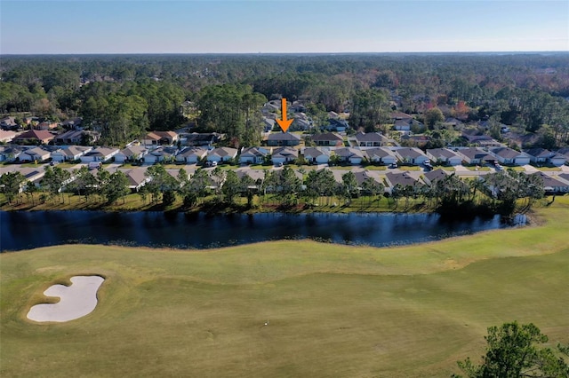 drone / aerial view with a water view and a residential view