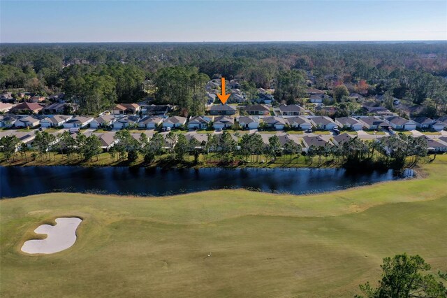 birds eye view of property featuring a water view and a residential view