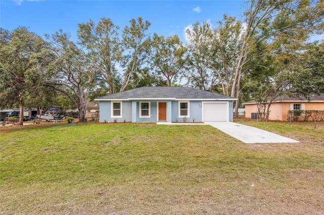 single story home featuring a front yard, stucco siding, concrete driveway, a garage, and central air condition unit