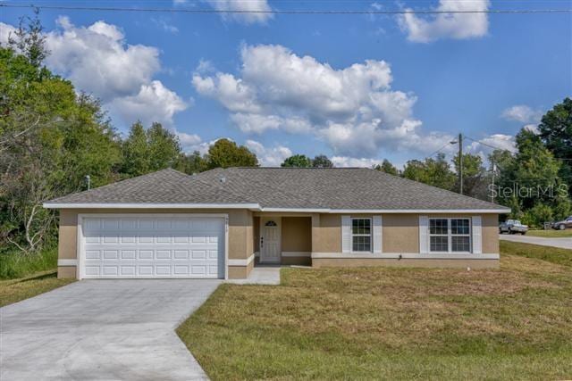 single story home with a front yard, an attached garage, driveway, and stucco siding