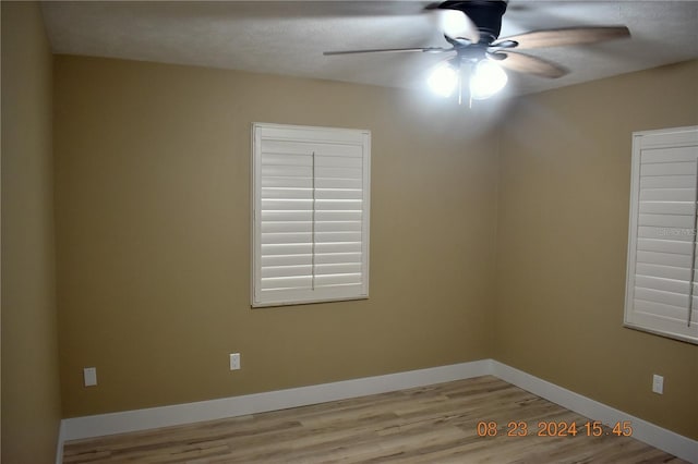 empty room featuring light wood-type flooring and ceiling fan