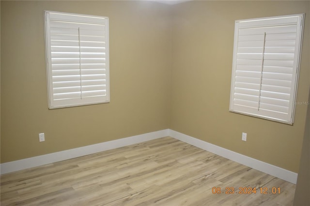 spare room with light hardwood / wood-style floors