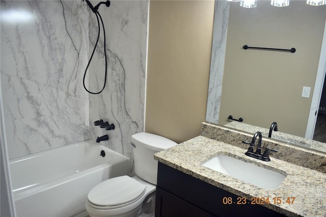 full bathroom featuring toilet, tiled shower / bath, and vanity