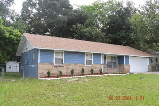 single story home featuring a front yard and a garage