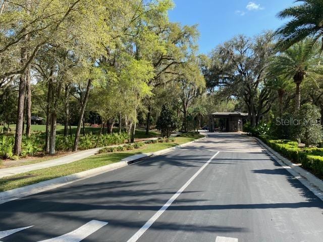 view of road featuring curbs and sidewalks