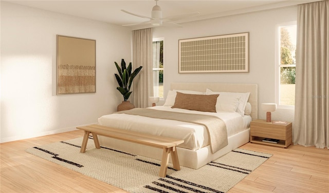 bedroom featuring hardwood / wood-style floors and ceiling fan