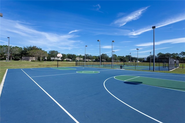 view of sport court featuring community basketball court and fence