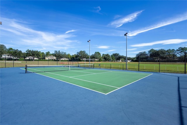 view of sport court featuring community basketball court and fence