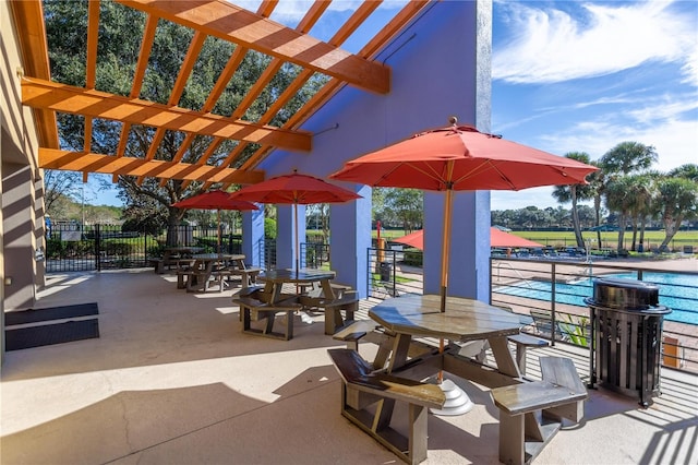 view of patio featuring a pergola and fence