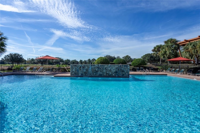 community pool with a patio area