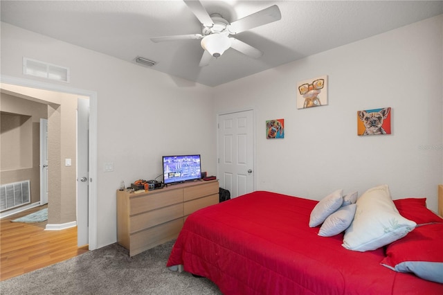 bedroom with visible vents and a ceiling fan