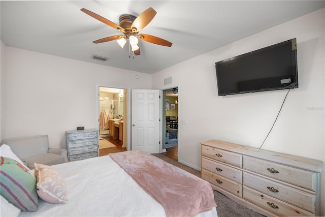 bedroom featuring visible vents, ceiling fan, and ensuite bathroom