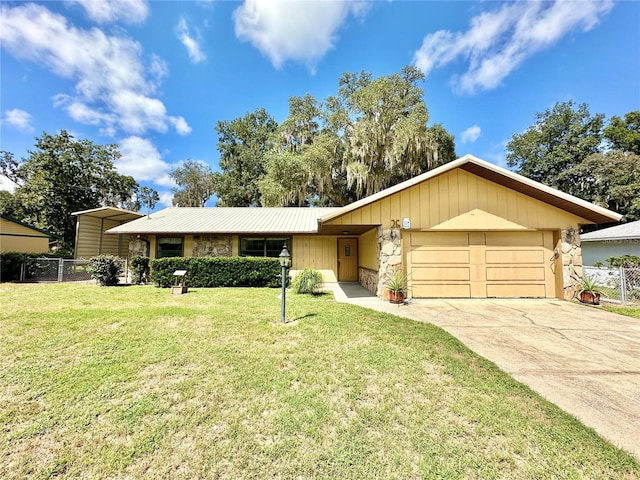 ranch-style home with a garage and a front yard