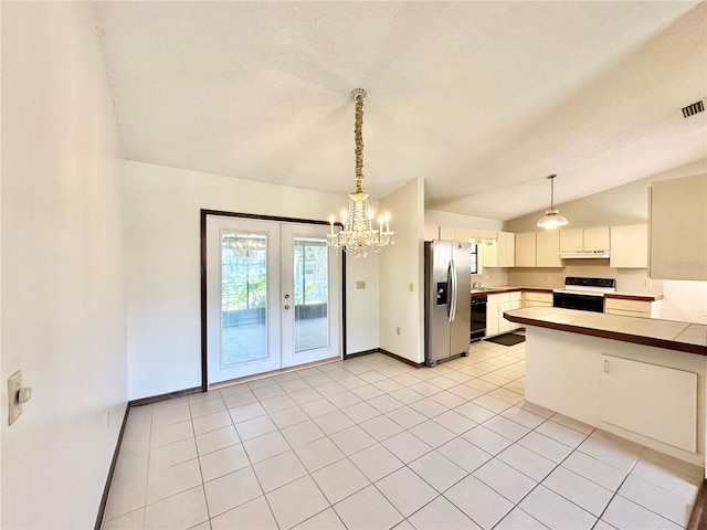 kitchen featuring stainless steel refrigerator with ice dispenser, light tile patterned floors, french doors, lofted ceiling, and white range with electric stovetop