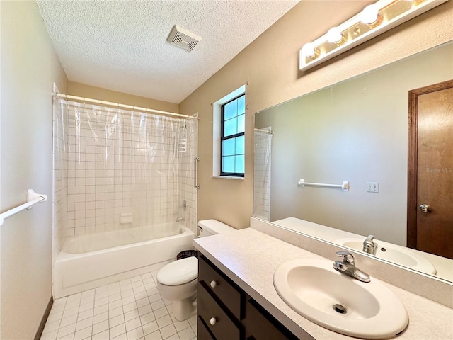 full bathroom featuring toilet, tile patterned flooring, vanity, a textured ceiling, and shower / tub combo with curtain