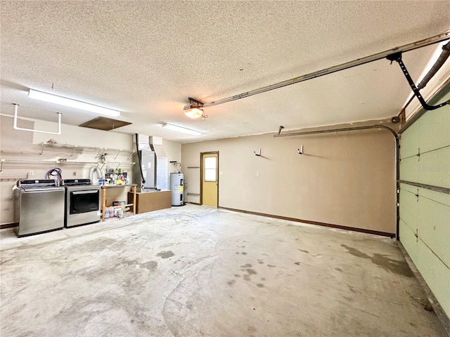 garage with a workshop area, heating unit, washer and clothes dryer, and electric water heater