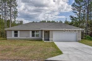 single story home with a front lawn and a garage