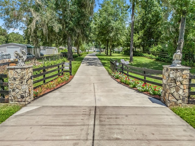 view of property's community featuring a yard