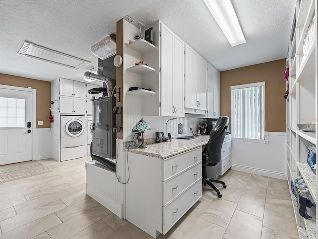 kitchen featuring visible vents, white cabinets, independent washer and dryer, a textured ceiling, and open shelves