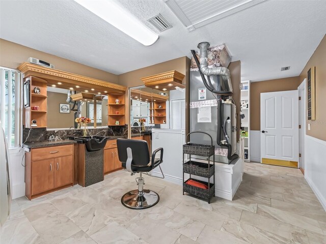 kitchen featuring a textured ceiling and light tile patterned floors